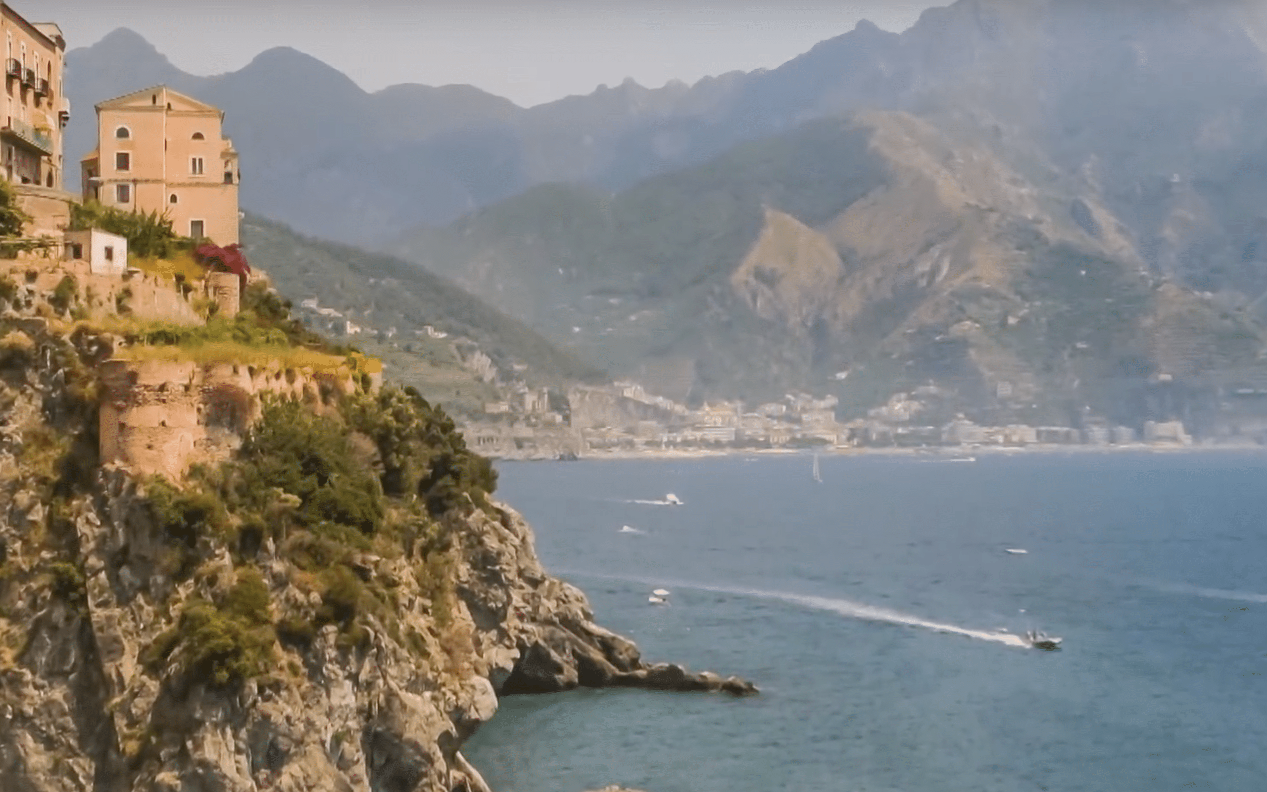 Perillo Tours Italy North Continental Tour Commercial features a beautiful landscape of Northern Italy village with the mountains and the water surrounding the villages (video production by Merging Media).