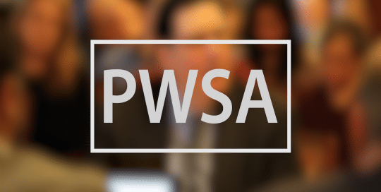 Mayor Peduto PWSA video thumbnail features blurred figure of a man in a suit sitting in front of background of an also sitting audience, the large text in the foreground in light grey font reads; PWSA (video produced by Merging Media).