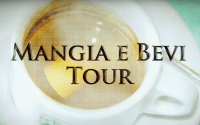 Perillo Tours Mangia E Bevi Tour Commercial thumbnail features a blurred out shot of Italian espresso in a classic white porcelain cup and saucer, words in foreground read; MANGIA E BEVI TOUR (video production by Merging Media).