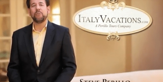 Perillo Tours Italy Vacations Commercial features Steve Perillo standing in his black sport coat and buttercream button down next to a word bubble that reads, ItalyVacations.com, A Perillo Tours Company (video produced by Merging Media).