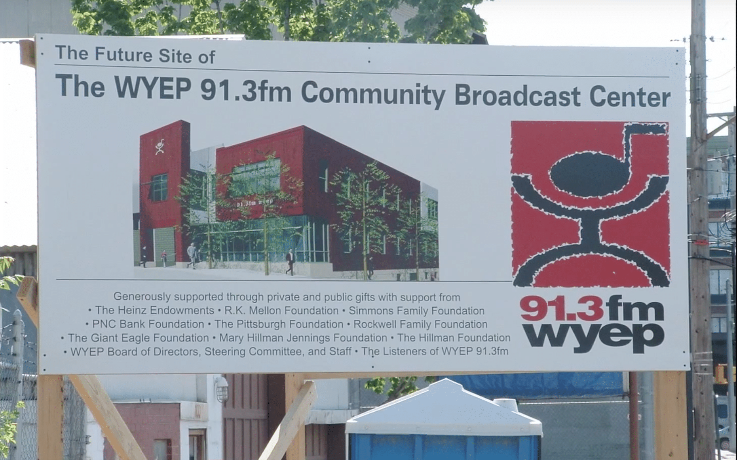 Construction site poster of the WYEP 91.3 fm Community Broadcast Center new building, Merging Media captures this construction in a fast photo movie (video production by Merging Media).