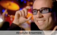 Club Cafe Absolute Ensemble features conductor Kristjan Järvi, in blue tinted glasses, speaking to the camera about his Absolute Ensemble and the performance at Club Cafe in Pittsburgh, Pennsylvania (video produced by Merging Media).