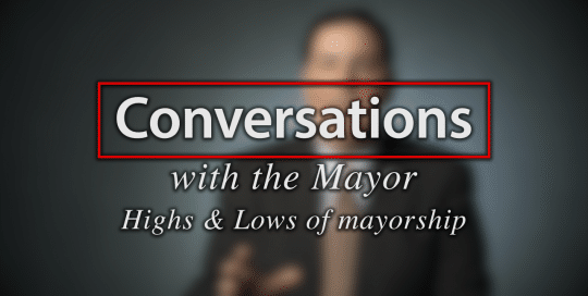 Mayor Peduto talks Mayorship; Blurred figure of a man in a suit sitting in front of a very dark blue background, the large word in the foreground in white text reads; Conversations with the Mayor, Highs and Low of Mayorship (video produced by Merging Media).